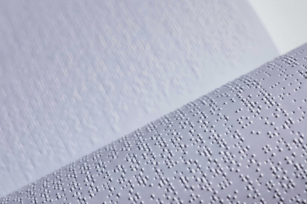 Brail text on white paper.